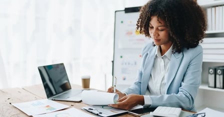 Executive Assistant planning an in-person meeting based on a small meetings travel policy